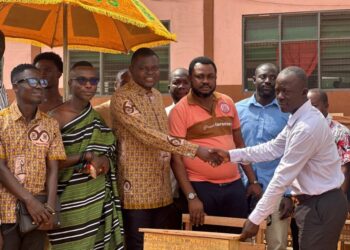 IMG-20251216-WA0323 KUHIS 2002 Group presents 100 desks to headmaster